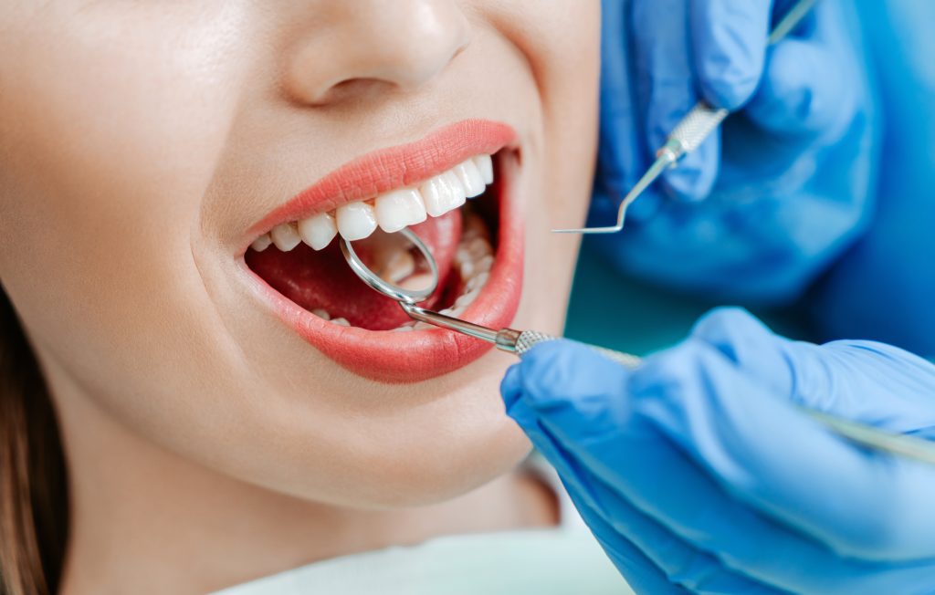 Dentist performing a preventive dental procedure at Dental Arts Toronto