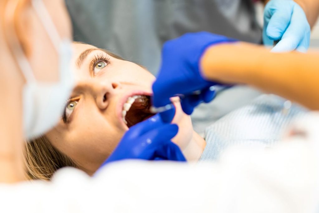 Dentist preparing for emergency impacted wisdom tooth extraction in Toronto