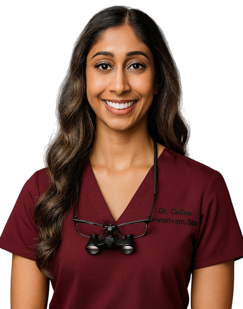 Dr. Celina Sewlochan, Toronto-based general and cosmetic dentist, smiling in a professional dental setting.