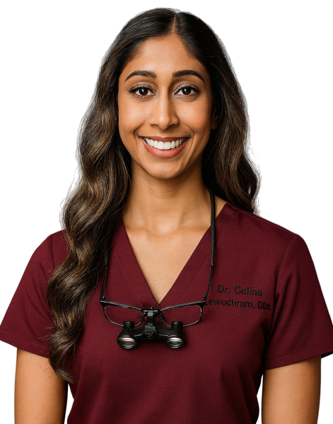 Dr. Celina Sewlochan, Toronto-based general and cosmetic dentist, smiling in a professional dental setting.